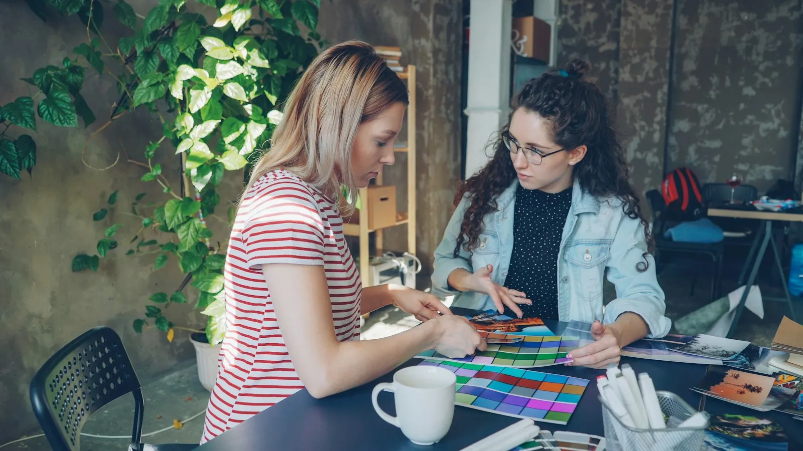 Two designers reviewing colors and layouts together
